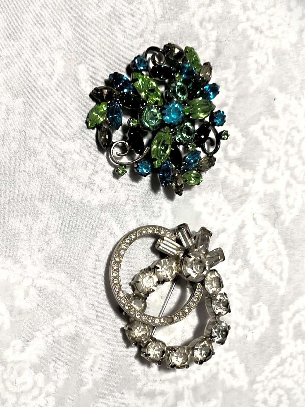 Lot of 2 mid-century vintage brooches: clear & multi green faceted rhinestone